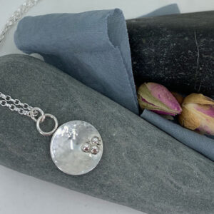 silver rock pool necklace hammered texture three pebbles