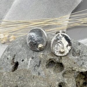 recycled silver circle stud earrings with organic textures and recycled gold detail