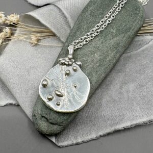 recycled silver handmade textured pendant.